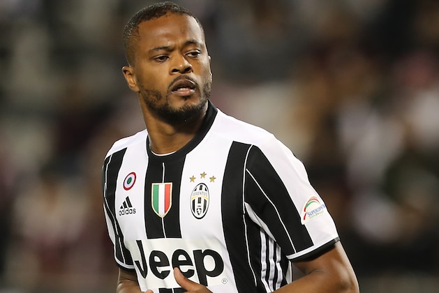 Juventus' Patrice Evra runs during the Italian Super Cup final match between AC Milan and Juventus in Doha on December 23, 2016. / AFP / KARIM JAAFAR        (Photo credit should read KARIM JAAFAR/AFP/Getty Images)