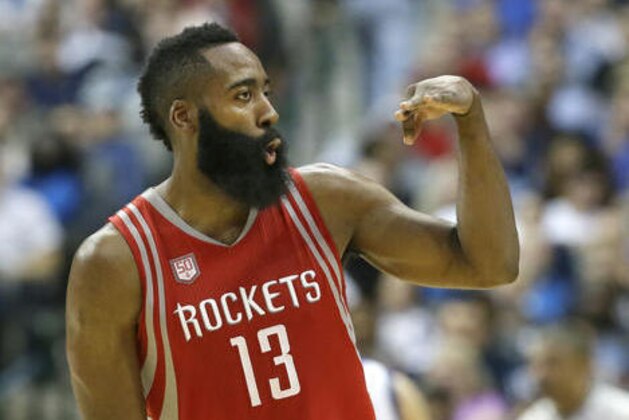 Houston Rockets guard James Harden (13) reacts to hitting a three pointer during the second half of an NBA basketball game against the Dallas Mavericks in Dallas, Tuesday, Dec. 27, 2016. The Rockets won 123-107. (AP Photo/LM Otero)