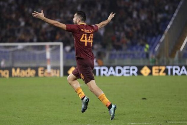 Roma’s Kostas Manolas celebrates after scoring during a Serie A soccer match between Roma and Inter Milan, at Rome's Olympic Stadium, Sunday, Oct. 2, 2016. (AP Photo/Andrew Medichini)
