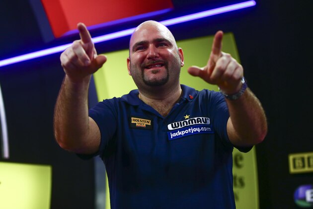 FRIMLEY, ENGLAND - JANUARY 10:  Scott Waites of England celebrates winning the Men's final match against Jeff Smith of Canada during Day Nine of the BDO Lakeside World Professional Darts Championships at The Lakeside Country Club on January 10, 2016 in Frimley, England.  (Photo by Jordan Mansfield/Getty Images)