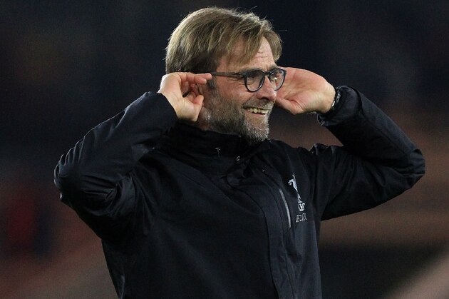 Liverpool's German manager Jurgen Klopp gestures to the fans following the English Premier League football match between Middlesbrough and Liverpool at Riverside Stadium in Middlesbrough, northeast England on December 14, 2016.
Liverpool won the match 3-0. / AFP / Lindsey PARNABY / RESTRICTED TO EDITORIAL USE. No use with unauthorized audio, video, data, fixture lists, club/league logos or 'live' services. Online in-match use limited to 75 images, no video emulation. No use in betting, games or single club/league/player publications.  /         (Photo credit should read LINDSEY PARNABY/AFP/Getty Images)