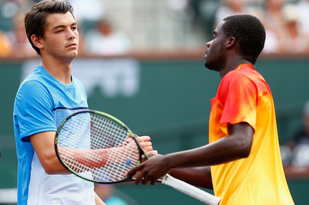 INDIAN WELLS, CA - MARCH 10:  Frances Tiafoe of USA is congratulated by Taylor Fritz of USA after he won in three sets during day four of the BNP Paribas Open at Indian Wells Tennis Garden on March 10, 2016 in Indian Wells, California.  (Photo by Julian Finney/Getty Images)
