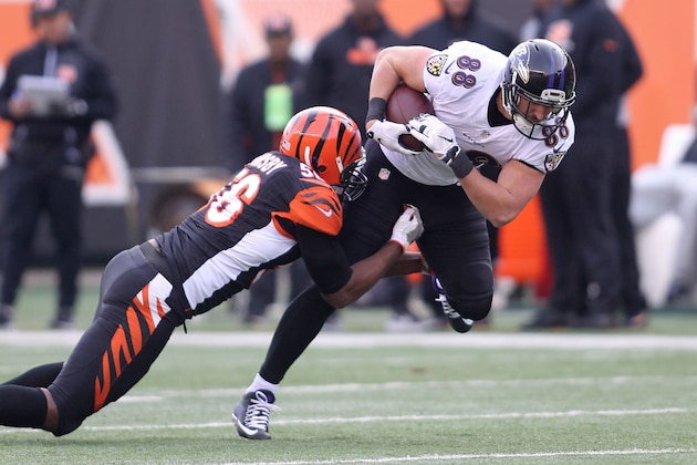 CINCINNATI, OH - JANUARY 1:  Karlos Dansby #56 of the Cincinnati Bengals tackles Dennis Pitta #88 of the Baltimore Ravens during the third quarter at Paul Brown Stadium on January 1, 2017 in Cincinnati, Ohio. (Photo by John Grieshop/Getty Images)
