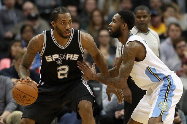 DENVER, CO - JANUARY 05: Kawhi Leonard #2 of the San Antonio Spurs inches towards the basket while being guarded by Will Barton #5 of the Denver Nuggets at the Pepsi Center on January 5, 2017 in Denver, Colorado.  NOTE TO USER: User expressly acknowledges and agrees that , by downloading and or using this photograph, User is consenting to the terms and conditions of the Getty Images License Agreement.  (Photo by Matthew Stockman/Getty Images)