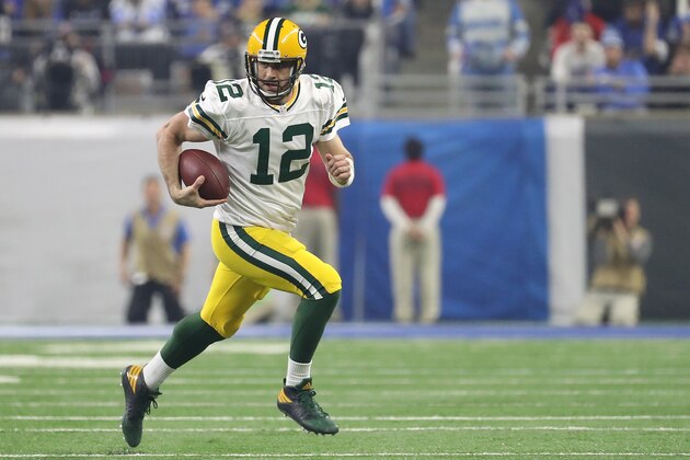 DETROIT, MI - JANUARY 01: Aaron Rodgers #12 of the Green Bay Packers runs for a first down during the second quarter of the game against the Detroit Lions at Ford Field on January 1, 2017 in Detroit, Michigan. Green Bay defeated Detroit 31-24. (Photo by Leon Halip/Getty Images)