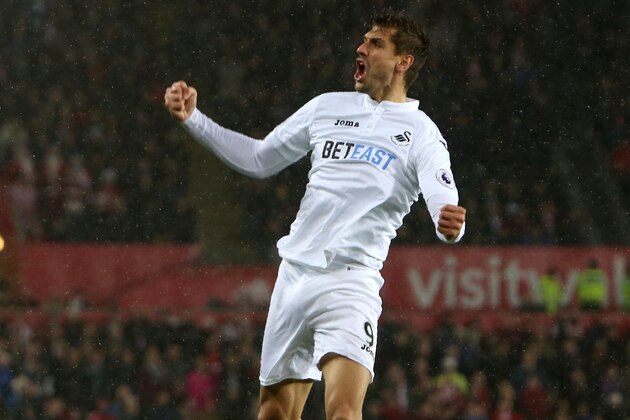 Swansea City's Spanish striker Fernando Llorente celebrates after scoring their second goal during the English Premier League football match between Swansea City and Sunderland at The Liberty Stadium in Swansea, south Wales on December 10, 2016. / AFP / Geoff CADDICK / RESTRICTED TO EDITORIAL USE. No use with unauthorized audio, video, data, fixture lists, club/league logos or 'live' services. Online in-match use limited to 75 images, no video emulation. No use in betting, games or single club/league/player publications.  /         (Photo credit should read GEOFF CADDICK/AFP/Getty Images)
