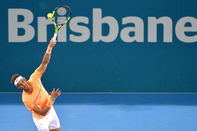 BRISBANE, AUSTRALIA - JANUARY 06:  Rafael Nadal of Spain serves against Milos Raonic of Canada on day six of the 2017 Brisbane International at Pat Rafter Arena on January 6, 2017 in Brisbane, Australia.  (Photo by Bradley Kanaris/Getty Images)