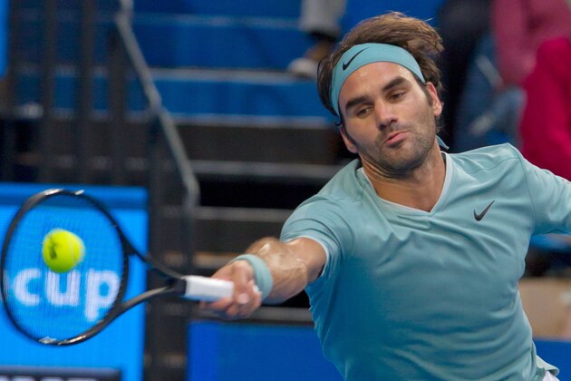 Roger Federer of Switzerland hits a return against Richard Gasquet of France during their twelth session men's singles match on day six of the Hopman Cup tennis tournament in Perth on January 6, 2017.   / AFP / Tony ASHBY / IMAGE RESTRICTED TO EDITORIAL USE - STRICTLY NO COMMERCIAL USE        (Photo credit should read TONY ASHBY/AFP/Getty Images)