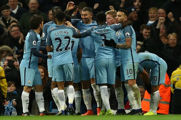 MANCHESTER, ENGLAND - JANUARY 02: Manchester City players celebrate the goal scored by Sergio Aguero during the Premier League match between Manchester City and Burnley at Etihad Stadium on January 2, 2017 in Manchester, England.  (Photo by Jan Kruger/Getty Images)