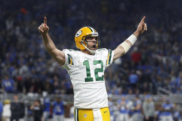 Green Bay Packers quarterback Aaron Rodgers (12) celebrates his 9-yard touchdown pass to wide receiver Davante Adams against the Detroit Lions during an NFL football game in Detroit, Sunday, Jan. 1, 2017. (AP Photo/Paul Sancya)