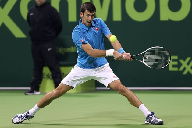 TOPSHOT - Serbia's Novak Djokovic returns the ball to Spain's Fernando Verdasco during their semi-final tennis match of the ATP Qatar Open in Doha on January 6, 2017. / AFP / KARIM JAAFAR        (Photo credit should read KARIM JAAFAR/AFP/Getty Images)