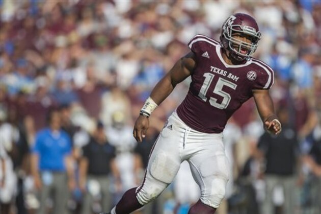 Texas A&M defensive lineman Myles Garrett (15) looks for the ball against UCLA during the third quarter of an NCAA college football game Saturday, Sept. 3, 2016, in College Station, Texas. Texas A&M won 31-24 in overtime. (AP Photo/Sam Craft)