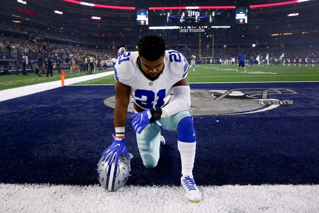 ARLINGTON, TX - DECEMBER 26: Ezekiel Elliott #21 of the Dallas Cowboys takes a knee in the end zone before the Cowboys play the Detroit Lions at AT&T Stadium on December 26, 2016 in Arlington, Texas. (Photo by Tom Pennington/Getty Images)