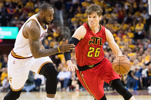 CLEVELAND, OH - MAY 2: Kyle Korver #26 of the Atlanta Hawks drives around LeBron James #23 of the Cleveland Cavaliers during the second half of the NBA Eastern Conference semifinals at Quicken Loans Arena on May 2, 2016 in Cleveland, Ohio. The Cavaliers defeated the Hawks 104-93. NOTE TO USER: User expressly acknowledges and agrees that, by downloading and or using this photograph, User is consenting to the terms and conditions of the Getty Images License Agreement. (Photo by Jason Miller/Getty Images)