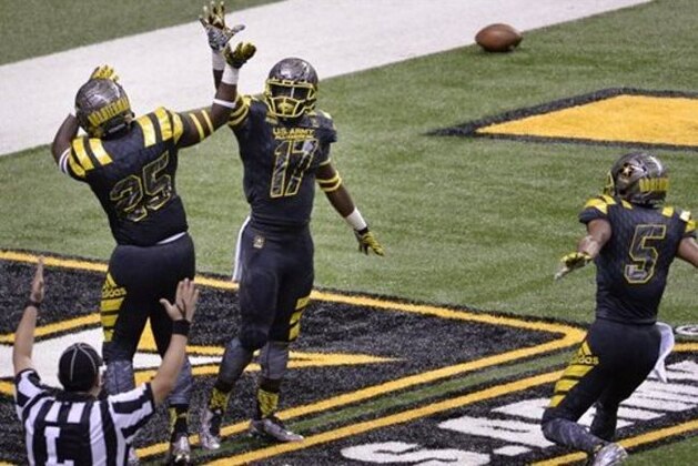 East's Tyler Byrd (17) celebrates a touchdown with teammates Shaquille Quarterman (25) and Demetris Robertson during the first half of the Army All American Bowl high school football game against the West, Saturday, Jan. 9, 2016, in San Antonio. (AP Photo/Darren Abate)