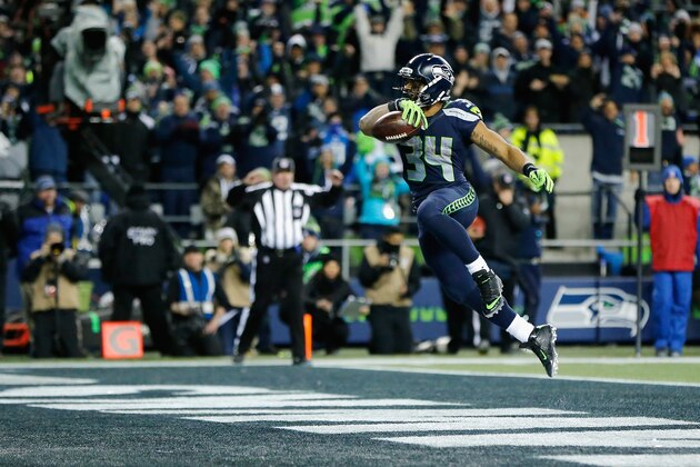 SEATTLE, WA - JANUARY 07:  Thomas Rawls #34 of the Seattle Seahawks scores a 4-yard touchdown during the fourth quarter against the Detroit Lions in the NFC Wild Card game at CenturyLink Field on January 7, 2017 in Seattle, Washington.  (Photo by Jonathan Ferrey/Getty Images)