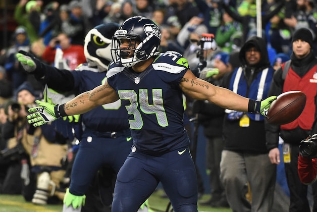 SEATTLE, WA - JANUARY 07:  Thomas Rawls #34 of the Seattle Seahawks celebrates scoring a 4-yard touchdown during the fourth quarter against the Detroit Lions in the NFC Wild Card game at CenturyLink Field on January 7, 2017 in Seattle, Washington.  (Photo by Steve Dykes/Getty Images)