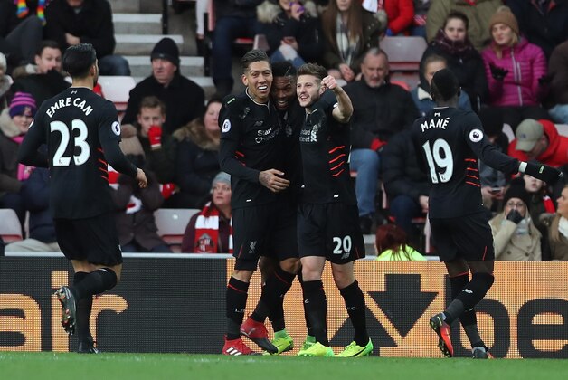 SUNDERLAND, ENGLAND - JANUARY 02: Daniel Sturridge of Liverpool (C) celebrates scoring his sides first goal with his Liverpool team mates during the Premier League match between Sunderland and Liverpool at Stadium of Light on January 2, 2017 in Sunderland, England.  (Photo by Ian MacNicol/Getty Images)