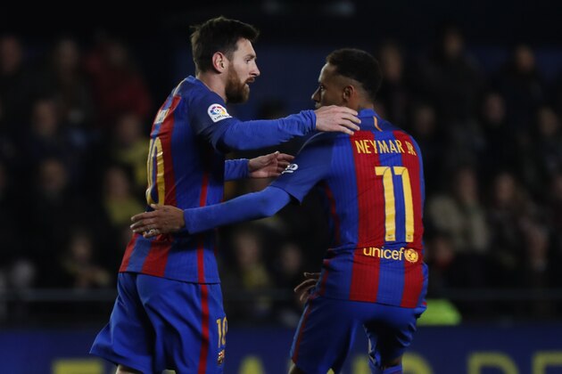 Barcelona's Argentinian forward Lionel Messi (L) celebrates with Barcelona's Brazilian forward Neymar after scoring during the Spanish league football match Villarreal CF vs FC Barcelona at El Madrigal stadium in Vila-real on January 8, 2017. / AFP / JOSE JORDAN        (Photo credit should read JOSE JORDAN/AFP/Getty Images)