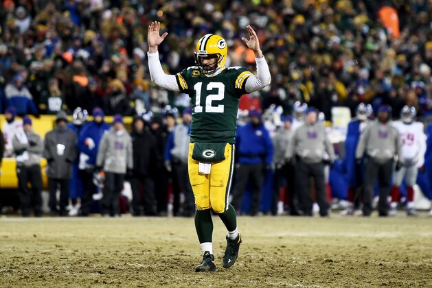 GREEN BAY, WI - JANUARY 8: Aaron Rodgers #12 of the Green Bay Packers celebrates after scoring a touchdown in the fourth quarter during the NFC Wild Card game against the New York Giants at Lambeau Field on January 8, 2017 in Green Bay, Wisconsin. (Photo by Stacy Revere/Getty Images) GREEN BAY, WI - JANUARY 8: Aaron Rodgers #12 of the Green Bay Packers celebrates after scoring a touchdown in the fourth quarter during the NFC Wild Card game against the New York Giants at Lambeau Field on January 8, 2017 in Green Bay, Wisconsin. (Photo by Stacy Revere/Getty Images)