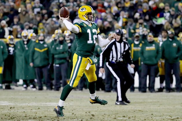 GREEN BAY, WI - JANUARY 8:  Aaron Rodgers #12 of the Green Bay Packers throws a pass in the second quarter during the NFC Wild Card game against the New York Giants at Lambeau Field on January 8, 2017 in Green Bay, Wisconsin. (Photo by Jonathan Daniel/Getty Images)