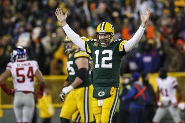Green Bay Packers Aaron Rodgers reacts after his touchdown pass to Randall Cobb during an NFL football game on Sunday, Jan. 8, 2017, in Green Bay, Wis. (Jeffrey Phelps/AP Images)