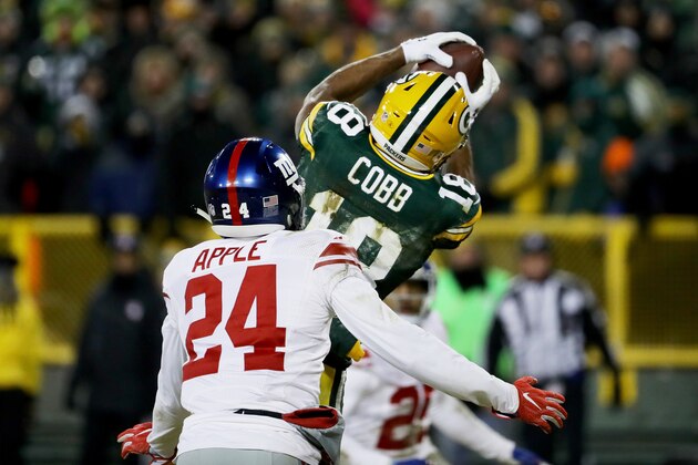 GREEN BAY, WI - JANUARY 8:  Randall Cobb #18 of the Green Bay Packers catches a touchdown pass while being guarded by Eli Apple #24 of the New York Giants in the fourth quarter during the NFC Wild Card game at Lambeau Field on January 8, 2017 in Green Bay, Wisconsin.  (Photo by Jonathan Daniel/Getty Images)