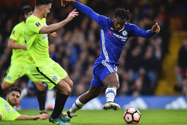 Chelsea's Belgian striker Michy Batshuayi (R) battles with Peterborough United's English defender Ryan Tafazolli (L) during the English FA Cup third round football match between Chelsea and Peterborough at Stamford Bridge in London on January 8, 2017. / AFP / Glyn KIRK / RESTRICTED TO EDITORIAL USE. No use with unauthorized audio, video, data, fixture lists, club/league logos or 'live' services. Online in-match use limited to 75 images, no video emulation. No use in betting, games or single club/league/player publications.  /         (Photo credit should read GLYN KIRK/AFP/Getty Images)