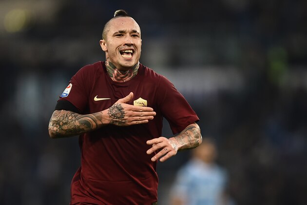 Roma's midfielder from Belgium Radja Nainggolan celebrates after scoring during the Italian Serie A football match SS Lazio vs AS Roma on December 4, 2016 at the Olympic stadium in Rome.  / AFP / FILIPPO MONTEFORTE        (Photo credit should read FILIPPO MONTEFORTE/AFP/Getty Images)