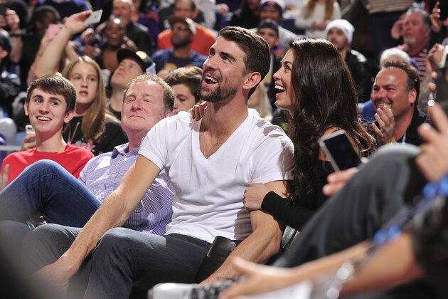 PHOENIX, AZ - JANUARY 8: Nicole and Michael Phelps attends the game between the Cleveland Cavaliers and the Phoenix Suns on January 8, 2017 at Talking Stick Resort Arena in Phoenix, Arizona. NOTE TO USER: User expressly acknowledges and agrees that, by downloading and or using this photograph, user is consenting to the terms and conditions of the Getty Images License Agreement. Mandatory Copyright Notice: Copyright 2017 NBAE (Photo by Barry Gossage/NBAE via Getty Images) PHOENIX, AZ - JANUARY 8: Nicole and Michael Phelps attends the game between the Cleveland Cavaliers and the Phoenix Suns on January 8, 2017 at Talking Stick Resort Arena in Phoenix, Arizona. NOTE TO USER: User expressly acknowledges and agrees that, by downloading and or using this photograph, user is consenting to the terms and conditions of the Getty Images License Agreement. Mandatory Copyright Notice: Copyright 2017 NBAE (Photo by Barry Gossage/NBAE via Getty Images)