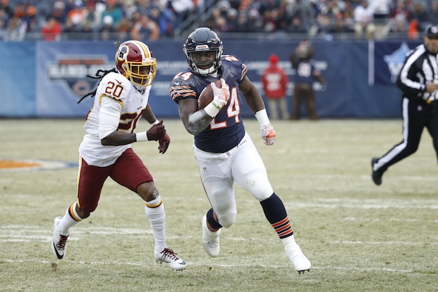 CHICAGO, IL - DECEMBER 24: Jordan Howard #24 of the Chicago Bears runs the ball while chased by Greg Toler #20 of the Washington Redskins during the game at Soldier Field on December 24, 2016 in Chicago, Illinois. Washington defeated Chicago 41-21. (Photo by Joe Robbins/Getty Images)