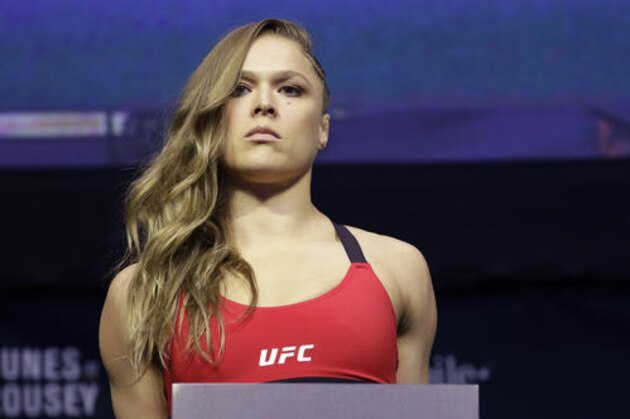 Ronda Rousey poses for photographers during an event for UFC 207, Thursday, Dec. 29, 2016, in Las Vegas. Rousey is scheduled to fight Amanda Nunes in a mixed martial arts women's bantamweight championship bout Saturday in Las Vegas. (AP Photo/John Locher)