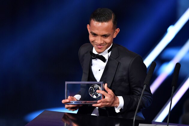 Penang FA and Malaysia's midfielder Mohd Faiz Subri holds his trophy after winning The 2016 FIFA Puskas Award during The Best FIFA Football Awards ceremony, on January 9, 2017 in Zurich. / AFP / Fabrice COFFRINI        (Photo credit should read FABRICE COFFRINI/AFP/Getty Images)