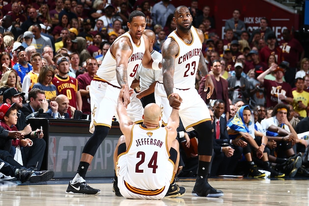 CLEVELAND, OH - JUNE 8: LeBron James #23 and Channing Frye #9 of the Cleveland Cavaliers help up Richard Jefferson #24 of the Cleveland Cavaliers during the game against the Golden State Warriors during the 2016 NBA Finals Game Three on June 8, 2016 at Quicken Loans Arena in Cleveland, Ohio.  NOTE TO USER: User expressly acknowledges and agrees that, by downloading and or using this Photograph, user is consenting to the terms and conditions of the Getty Images License Agreement. Mandatory Copyright Notice: Copyright 2016 NBAE (Photo by Nathaniel S. Butler/NBAE via Getty Images)