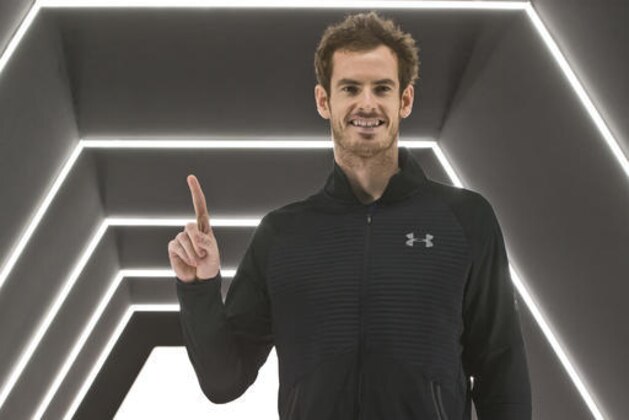 Britain's Andy Murray holds up his finger to show he is No. 1 after winning the final of the Paris Masters tennis tournament against John Isner of the United States in three sets at the Bercy Arena in Paris, Sunday, Nov. 6, 2016. (AP Photo/Michel Euler)