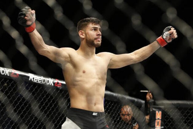 Yair Rodriguez celebrates after defeating Andre Fili during a featherweight mixed martial arts bout at UFC 197, Saturday, April 23, 2016, in Las Vegas. (AP Photo/John Locher)