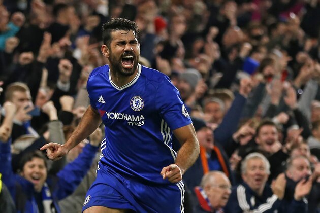 Chelsea's Brazilian-born Spanish striker Diego Costa celebrates after scoring their fourth goal during the English Premier League football match between Chelsea and Stoke City at Stamford Bridge in London on December 31, 2016.
Chelsea won the game 4-2. / AFP / Ian KINGTON / RESTRICTED TO EDITORIAL USE. No use with unauthorized audio, video, data, fixture lists, club/league logos or 'live' services. Online in-match use limited to 75 images, no video emulation. No use in betting, games or single club/league/player publications.  /         (Photo credit should read IAN KINGTON/AFP/Getty Images)