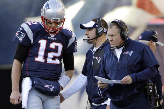 New England Patriots quarterback Tom Brady (12) listens to offensive coordinator Josh McDaniels, middle, and head coach Bill Belichick during the first half of an NFL football game against the Los Angeles Rams, Sunday, Dec. 4, 2016, in Foxborough, Mass. (AP Photo/Elise Amendola)