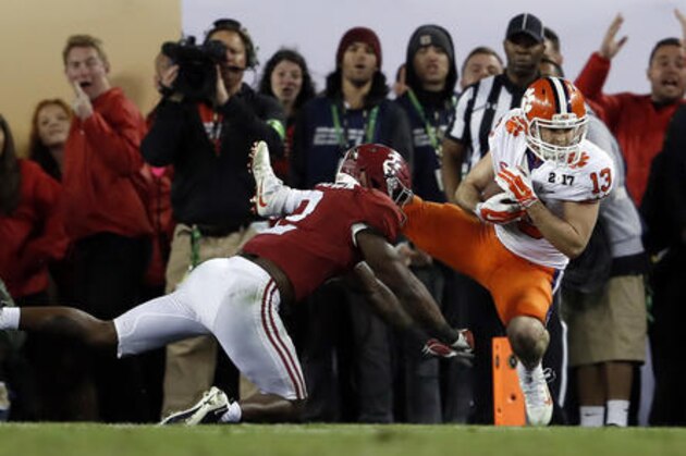 Clemson's Hunter Renfrow catches a touchdown pass in front of Alabama's Tony Brown during the second half of the NCAA college football playoff championship game Tuesday, Jan. 10, 2017, in Tampa, Fla. (AP Photo/John Bazemore)