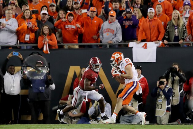 TAMPA, FL - JANUARY 09:  Wide receiver Hunter Renfrow #13 of the Clemson Tigers makes a 2-yard game-winning touchdown reception during the fourth quarter against defensive back Tony Brown #2 of the Alabama Crimson Tide during the fourth quarter of the 2017 College Football Playoff National Championship Game at Raymond James Stadium on January 9, 2017 in Tampa, Florida.  (Photo by Streeter Lecka/Getty Images)