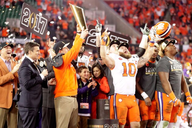 TAMPA, FL - JANUARY 09:  Head coach Dabo Swinney of the Clemson Tigers celebrates with the College Football Playoff National Championship Trophy after defeating the Alabama Crimson Tide 35-31 to win the 2017 College Football Playoff National Championship Game at Raymond James Stadium on January 9, 2017 in Tampa, Florida.  (Photo by Jamie Squire/Getty Images)