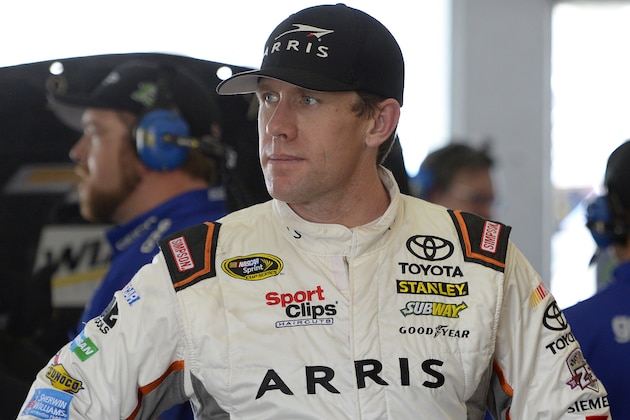 HOMESTEAD, FL - NOVEMBER 18:  Carl Edwards, driver of the #19 ARRIS Toyota, stands in the garage area during practice for the NASCAR Sprint Cup Series Ford EcoBoost 400 at Homestead-Miami Speedway on November 18, 2016 in Homestead, Florida.  (Photo by Robert Laberge/Getty Images)