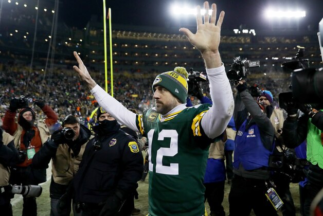 GREEN BAY, WI - JANUARY 8:  Aaron Rodgers #12 of the Green Bay Packers walks off the field after beating the New York Giants 38-13 in the NFC Wild Card game at Lambeau Field on January 8, 2017 in Green Bay, Wisconsin. (Photo by Jonathan Daniel/Getty Images)