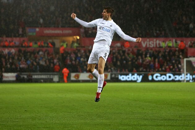 Swansea City's Spanish striker Fernando Llorente celebrates after scoring their second goal during the English Premier League football match between Swansea City and Sunderland at The Liberty Stadium in Swansea, south Wales on December 10, 2016. / AFP / Geoff CADDICK / RESTRICTED TO EDITORIAL USE. No use with unauthorized audio, video, data, fixture lists, club/league logos or 'live' services. Online in-match use limited to 75 images, no video emulation. No use in betting, games or single club/league/player publications.  /         (Photo credit should read GEOFF CADDICK/AFP/Getty Images)