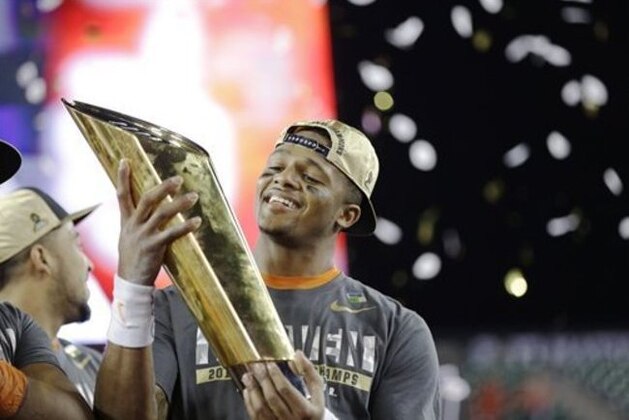 Clemson's Deshaun Watson holds up the championship trophy after the NCAA college football playoff championship game against Alabama Tuesday, Jan. 10, 2017, in Tampa, Fla. Clemson won 35-31. (AP Photo/David J. Phillip)