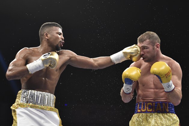 Jack Badou of Sweden (L) connects against Lucian Bute of Canada during their WBC Super Middleweight Championship boxing match in Washington, DC, May 1, 2016. The match ended in a draw.  / AFP / David Tulis        (Photo credit should read DAVID TULIS/AFP/Getty Images)