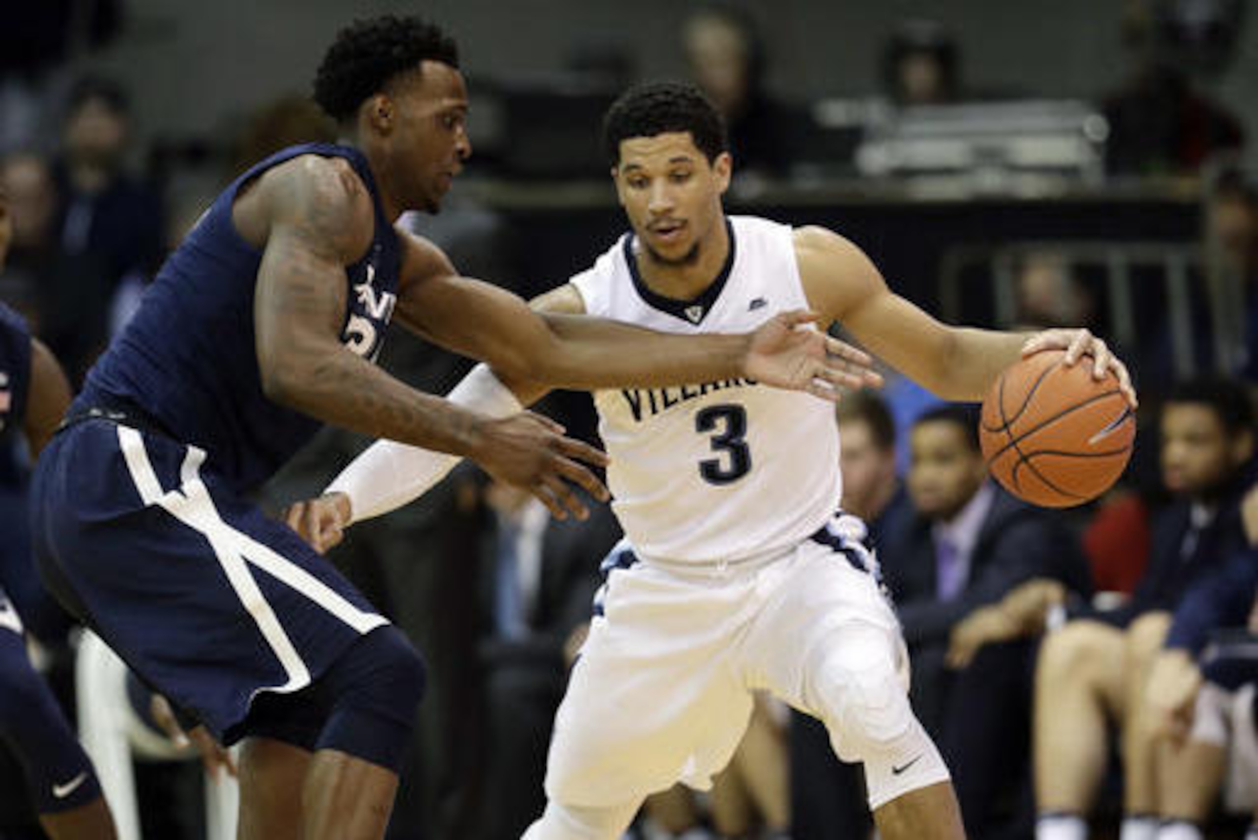 Villanova's Josh Hart, right, tries to keep the ball away from Xavier's RaShid Gaston during the second half of an NCAA college basketball game, Tuesday, Jan. 10, 2017, in Villanova, Pa. (AP Photo/Matt Slocum)