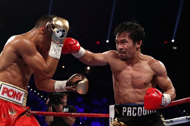 LAS VEGAS, NV - NOVEMBER 05: Manny Pacquiao (R) lands a right on Jessie Vargas during their WBO welterweight championship fight at the Thomas & Mack Center on November 5, 2016 in Las Vegas, Nevada. (Photo by Christian Petersen/Getty Images) LAS VEGAS, NV - NOVEMBER 05: Manny Pacquiao (R) lands a right on Jessie Vargas during their WBO welterweight championship fight at the Thomas & Mack Center on November 5, 2016 in Las Vegas, Nevada. (Photo by Christian Petersen/Getty Images)