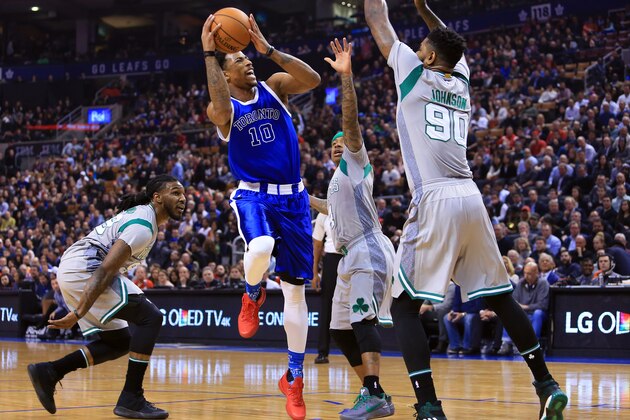 TORONTO, ON - JANUARY 10:  DeMar DeRozan #10 of the Toronto Raptors shoots the ball as Amir Johnson #90 of the Boston Celtics defends during the first half of an NBA game at Air Canada Centre on January 10, 2017 in Toronto, Canada.  NOTE TO USER: User expressly acknowledges and agrees that, by downloading and or using this photograph, User is consenting to the terms and conditions of the Getty Images License Agreement.  (Photo by Vaughn Ridley/Getty Images)