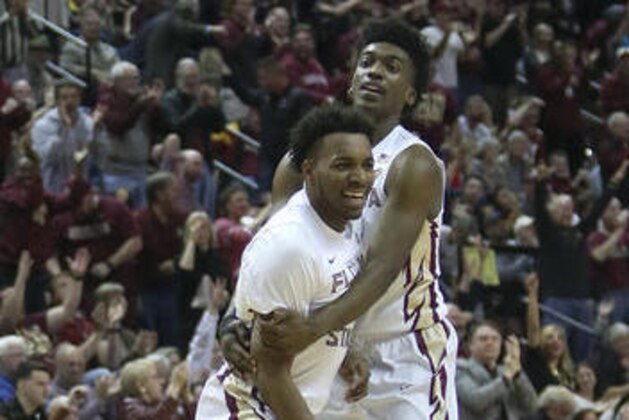 Florida State's P.J. Savoy gets a hug from teammate Terance Mann after hitting a three-pointer against Duke in the first half of an NCAA college basketball game, Tuesday, Jan. 10, 2017, in Tallahassee, Fla. (AP Photo/Steve Cannon) Florida State's P.J. Savoy gets a hug from teammate Terance Mann after hitting a three-pointer against Duke in the first half of an NCAA college basketball game, Tuesday, Jan. 10, 2017, in Tallahassee, Fla. (AP Photo/Steve Cannon)
